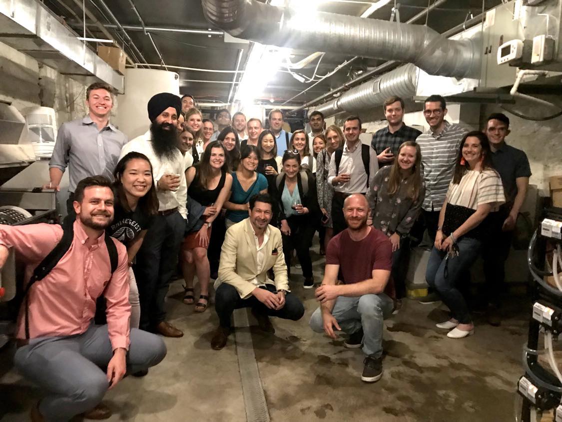 A private group gathered among the tanks in the Revel Urban Winery cellar