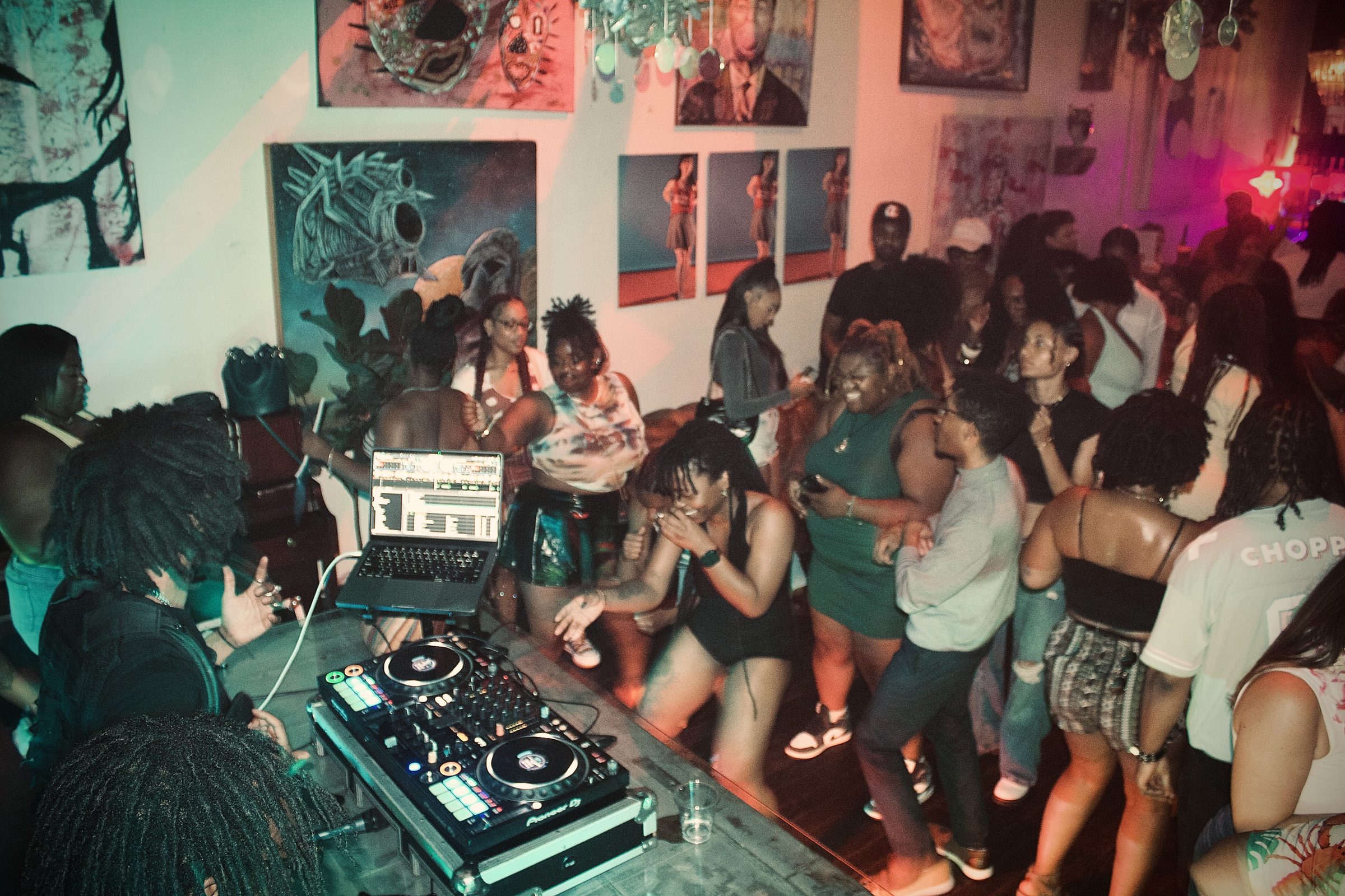 DJ booth and a packed dance floor at Revel OTR