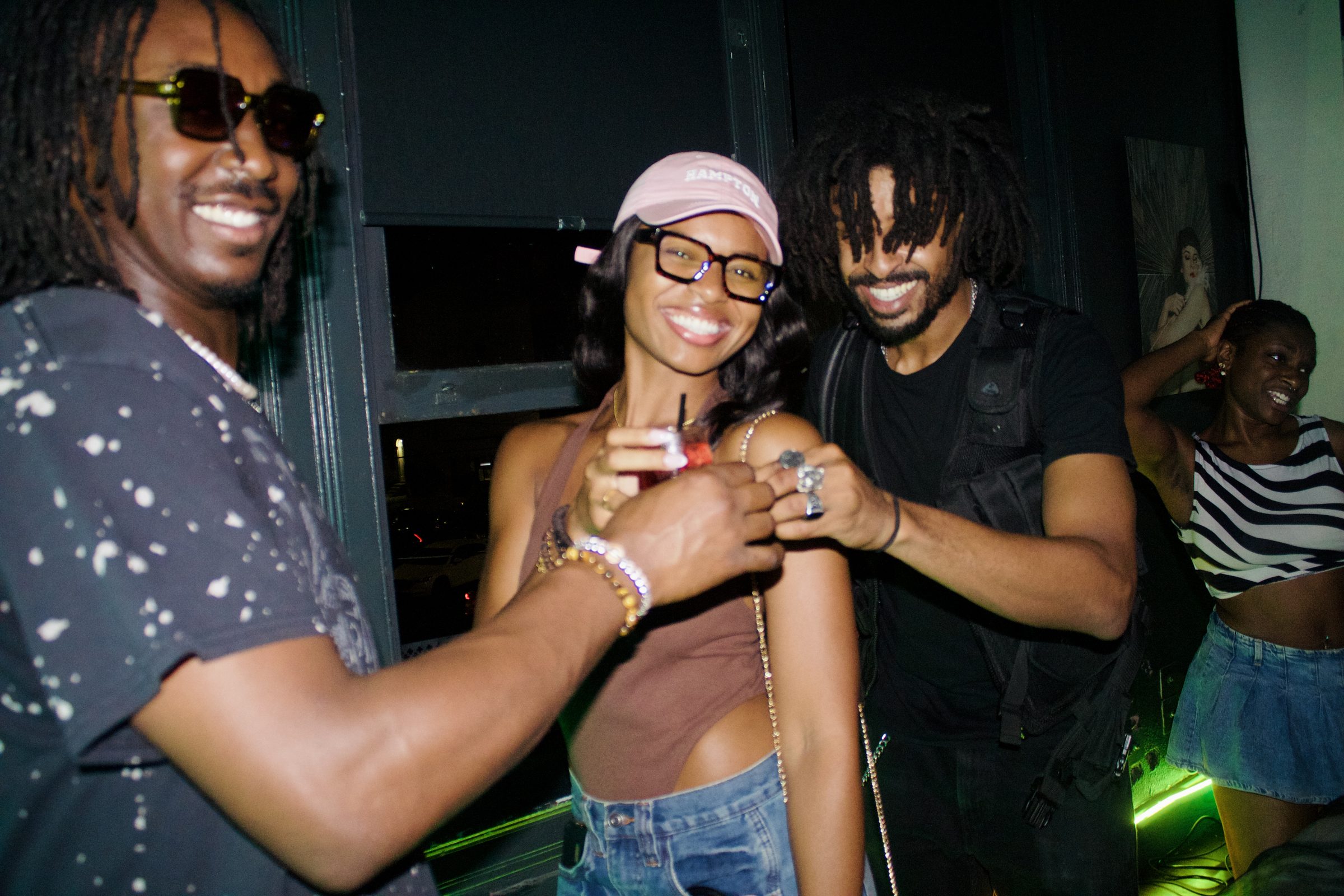 Guests toasting drinks together at a Revel OTR night