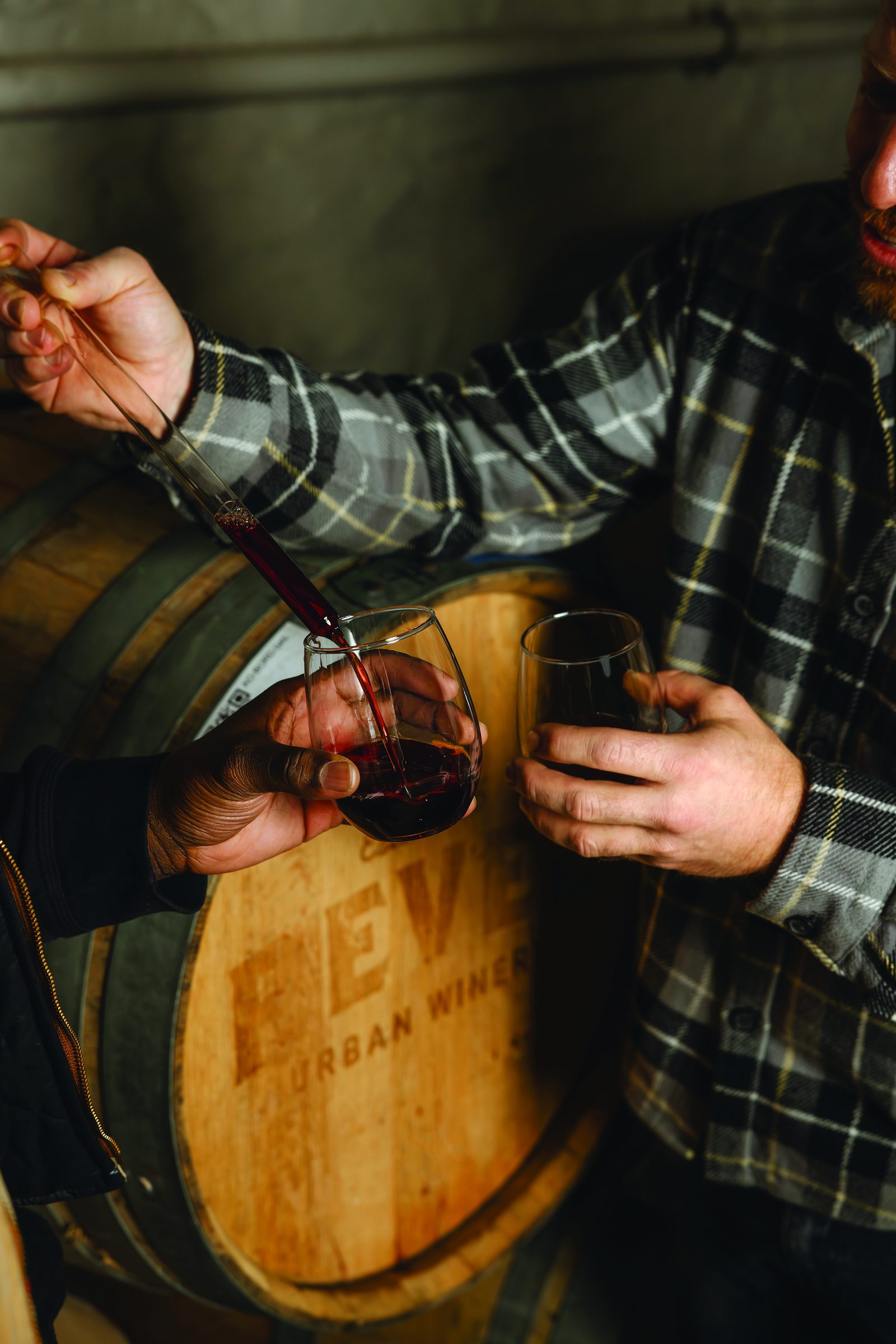Thieving red wine straight from a Revel Urban Winery barrel