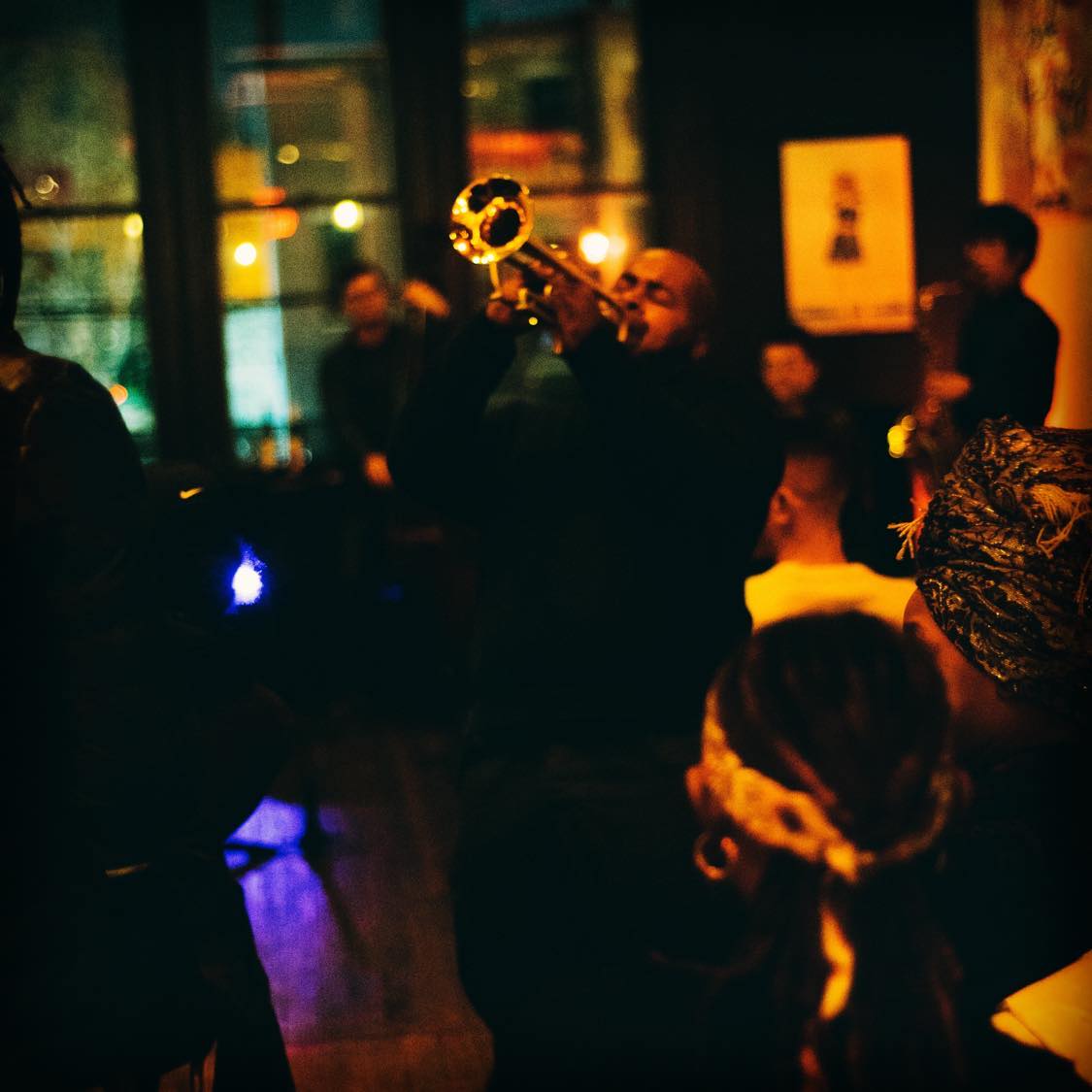 Trumpet player performing to a full room at Revel OTR